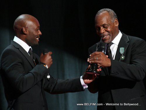 Jimmy Jean Louis Presenting TAAC Award to Danny Glover
